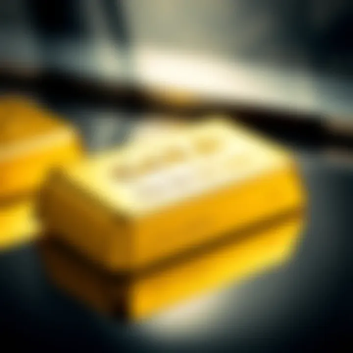 Close-up of a shiny gold bar resting on a reflective surface showcasing its smooth texture and embossed markings